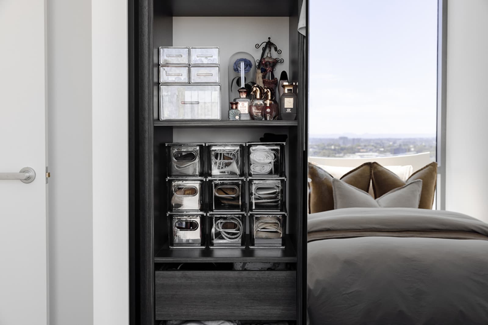 Small Sydney apartment storage with compact shelving, baskets and neutral organised zones