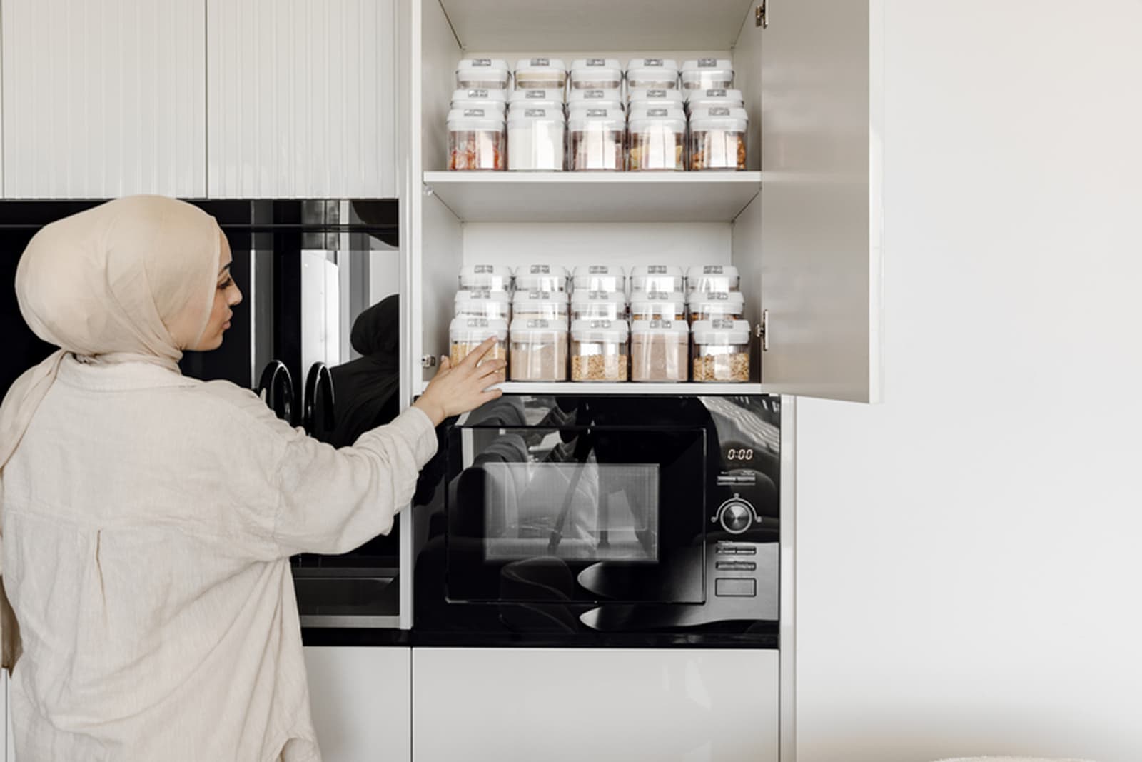Organised pantry shelves with matching baskets and clear containers
